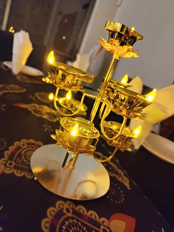 Golden candle lamps on the table