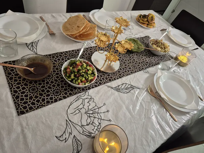 A candlelit table with Indian starters