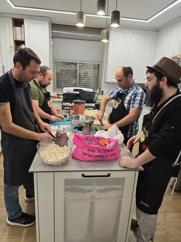 Four guests cooking side by side