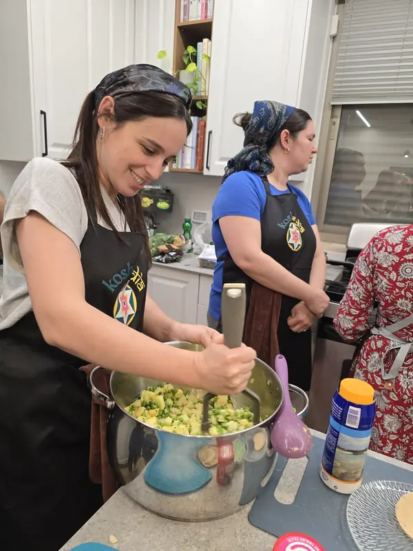 A guest mixing the samosa filling